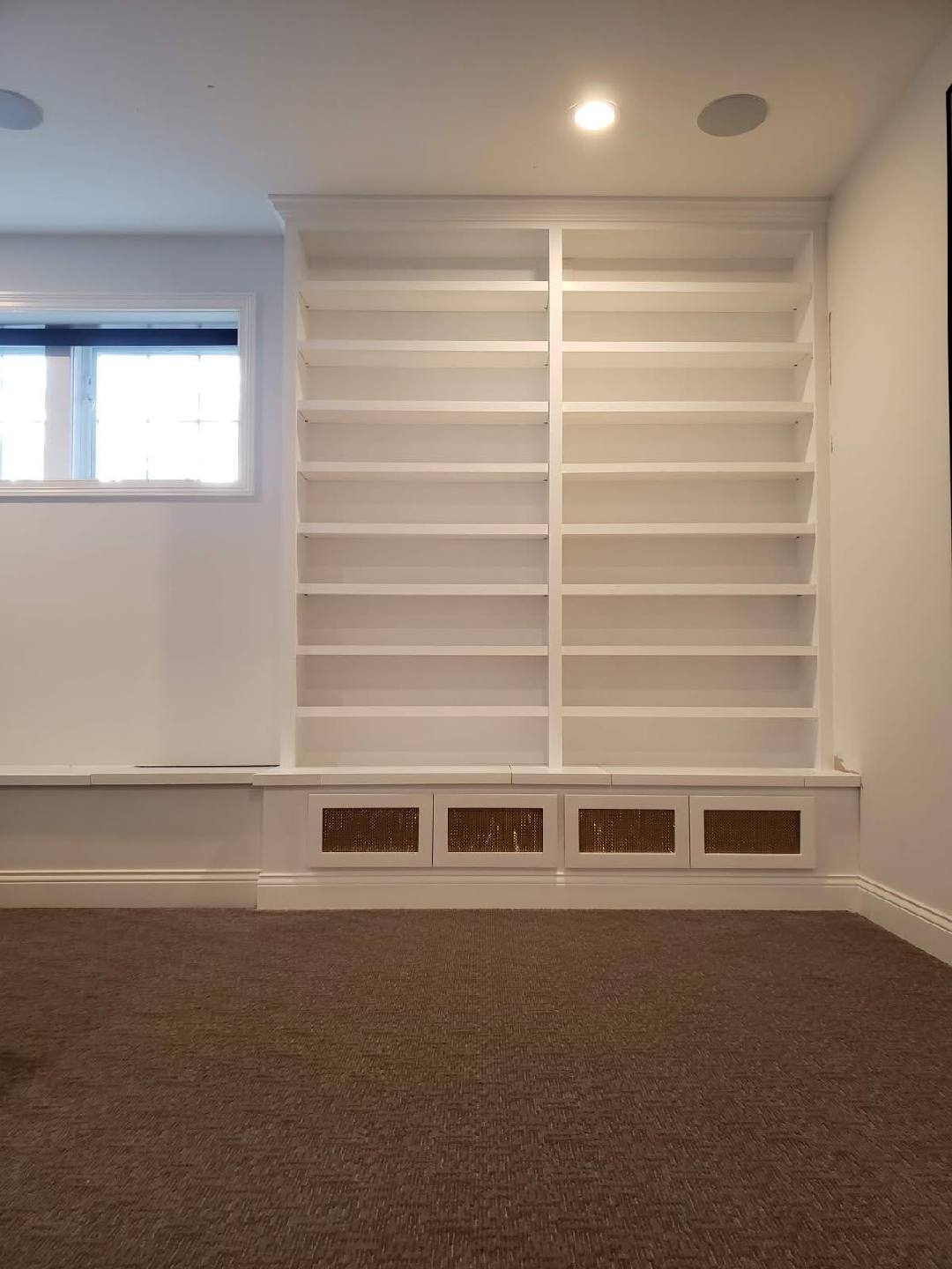Custom painted library shelving built-in